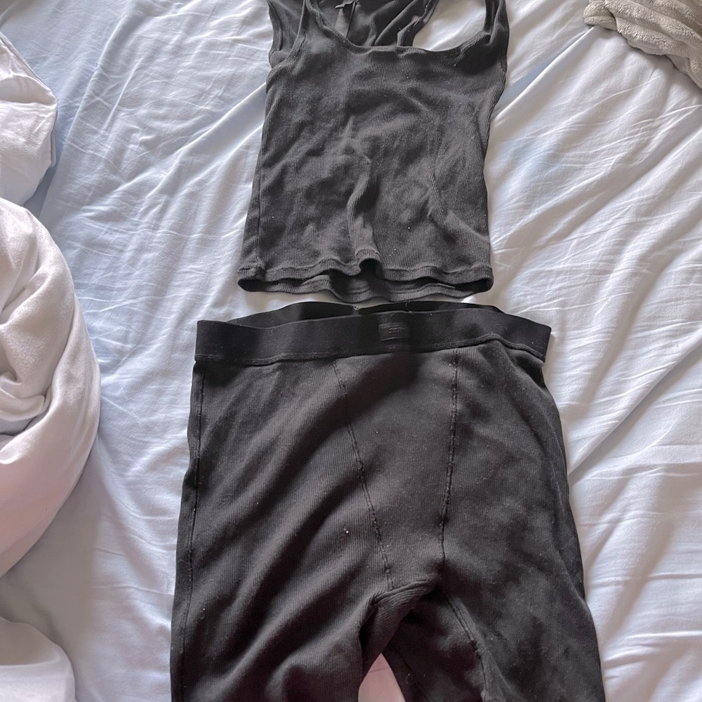 Skims tank and boxer shorts.